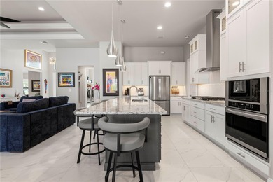 SHOWCASE HOME W/A WATER VIEW IN PGI! Check out this exceptional on Saint Andrews South Golf Club in Florida - for sale on GolfHomes.com, golf home, golf lot