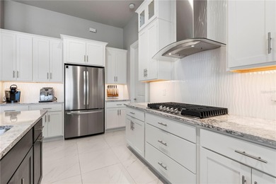 SHOWCASE HOME W/A WATER VIEW IN PGI! Check out this exceptional on Saint Andrews South Golf Club in Florida - for sale on GolfHomes.com, golf home, golf lot