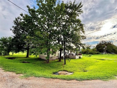 Two-bed, two-bath home situated on three spacious lots in the on Links At Lands End in Texas - for sale on GolfHomes.com, golf home, golf lot