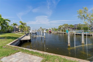 SHOWCASE HOME W/A WATER VIEW IN PGI! Check out this exceptional on Saint Andrews South Golf Club in Florida - for sale on GolfHomes.com, golf home, golf lot