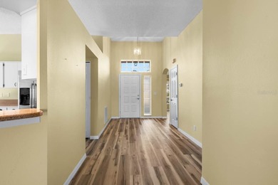 Step into effortless Florida living in this beautifully on Falcon Watch Golf Club in Florida - for sale on GolfHomes.com, golf home, golf lot