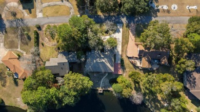 Beautiful lakefront home positioned in a peaceful and on Rocky Bayou Country Club in Florida - for sale on GolfHomes.com, golf home, golf lot