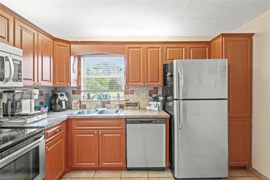Schedule to See This Spacious 3-Bedroom/2-Bath Unit in the on  in Florida - for sale on GolfHomes.com, golf home, golf lot