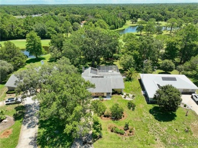 Long driveway and a majestic oak tree lead to this 3 bedroom 2 on Sugarmill Woods Golf and Country Club in Florida - for sale on GolfHomes.com, golf home, golf lot