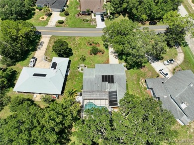 Long driveway and a majestic oak tree lead to this 3 bedroom 2 on Sugarmill Woods Golf and Country Club in Florida - for sale on GolfHomes.com, golf home, golf lot