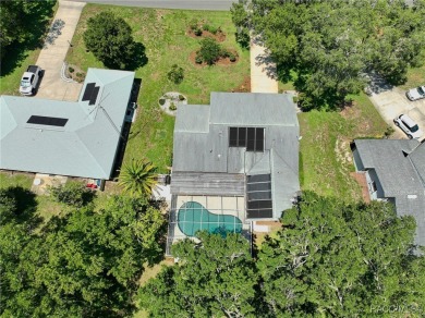 Long driveway and a majestic oak tree lead to this 3 bedroom 2 on Sugarmill Woods Golf and Country Club in Florida - for sale on GolfHomes.com, golf home, golf lot