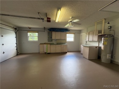 Long driveway and a majestic oak tree lead to this 3 bedroom 2 on Sugarmill Woods Golf and Country Club in Florida - for sale on GolfHomes.com, golf home, golf lot