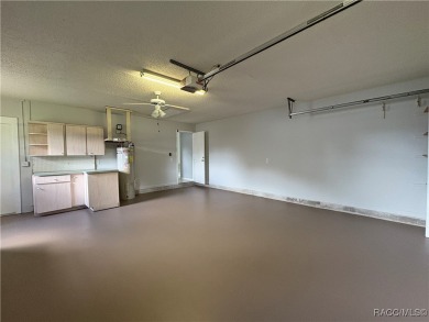 Long driveway and a majestic oak tree lead to this 3 bedroom 2 on Sugarmill Woods Golf and Country Club in Florida - for sale on GolfHomes.com, golf home, golf lot