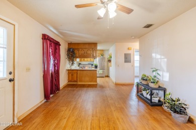 Beach Bungalow is located in the quaint neighborhood of Beach 87 on Sharks Tooth Golf Club in Florida - for sale on GolfHomes.com, golf home, golf lot