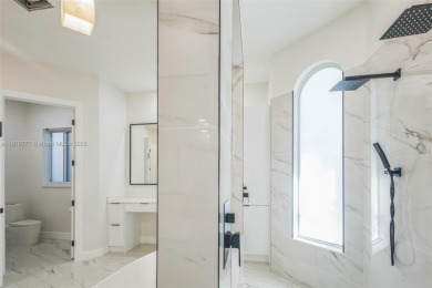 Complete modern remodeling. New Roof with 3 solar fans, Full on Heron Bay Golf Club in Florida - for sale on GolfHomes.com, golf home, golf lot