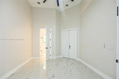 Complete modern remodeling. New Roof with 3 solar fans, Full on Heron Bay Golf Club in Florida - for sale on GolfHomes.com, golf home, golf lot