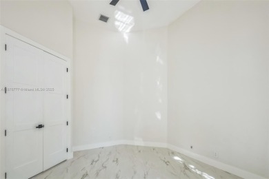 Complete modern remodeling. New Roof with 3 solar fans, Full on Heron Bay Golf Club in Florida - for sale on GolfHomes.com, golf home, golf lot