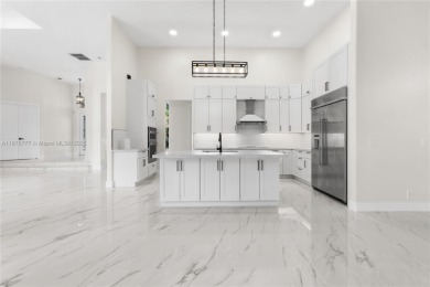 Complete modern remodeling. New Roof with 3 solar fans, Full on Heron Bay Golf Club in Florida - for sale on GolfHomes.com, golf home, golf lot