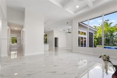 Complete modern remodeling. New Roof with 3 solar fans, Full on Heron Bay Golf Club in Florida - for sale on GolfHomes.com, golf home, golf lot