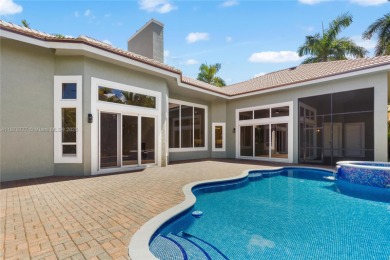 Complete modern remodeling. New Roof with 3 solar fans, Full on Heron Bay Golf Club in Florida - for sale on GolfHomes.com, golf home, golf lot