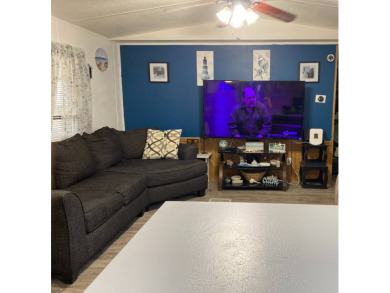 This 2/1.5 manufactured home is priced to sell. It is nestled up on Lake Henry Golf Club in Florida - for sale on GolfHomes.com, golf home, golf lot