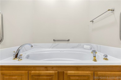 LAKE OF THE OZARKS - This exceptional townhome, nestled in the on The Club At Porto Cima in Missouri - for sale on GolfHomes.com, golf home, golf lot