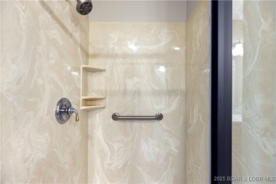 LAKE OF THE OZARKS - This exceptional townhome, nestled in the on The Club At Porto Cima in Missouri - for sale on GolfHomes.com, golf home, golf lot