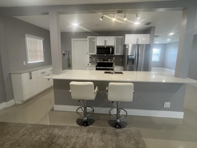 Beautifully updated and modern 2br/2ba home in Leisureville with on Leisureville Community Golf Course in Florida - for sale on GolfHomes.com, golf home, golf lot