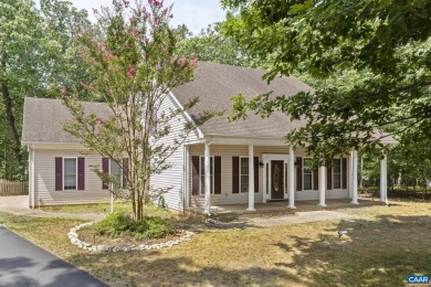 Nestled on a serene half-acre flat lot that backs to peaceful on Lake Monticello Golf Course in Virginia - for sale on GolfHomes.com, golf home, golf lot