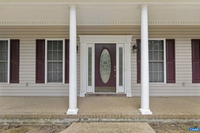 Nestled on a serene half-acre flat lot that backs to peaceful on Lake Monticello Golf Course in Virginia - for sale on GolfHomes.com, golf home, golf lot
