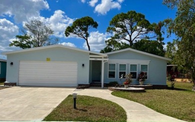 Beautifully renovated 2bd/2ba stucco home. Open concept layout on Del Tura Golf and Country Club in Florida - for sale on GolfHomes.com, golf home, golf lot
