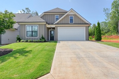 Welcome to this stunning, 4 bedroom/3 bathroom low-maintenance on Woodfin Ridge Golf Club in South Carolina - for sale on GolfHomes.com, golf home, golf lot