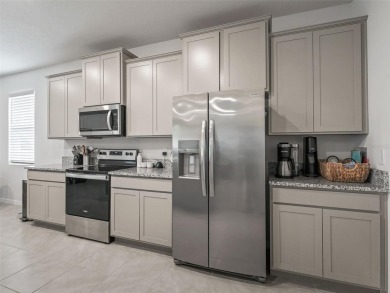 Built in 2023 in the all ages area! This 4 bedroom, 3 full on Trilogy at Ocala Preserve in Florida - for sale on GolfHomes.com, golf home, golf lot