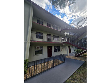 This inviting 2-bedroom, 1.5-bathroom condo on the 2nd floor on Flamingo Lakes Country Club in Florida - for sale on GolfHomes.com, golf home, golf lot