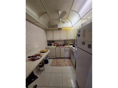 This inviting 2-bedroom, 1.5-bathroom condo on the 2nd floor on Flamingo Lakes Country Club in Florida - for sale on GolfHomes.com, golf home, golf lot