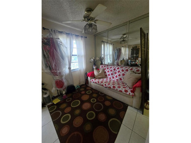 This inviting 2-bedroom, 1.5-bathroom condo on the 2nd floor on Flamingo Lakes Country Club in Florida - for sale on GolfHomes.com, golf home, golf lot