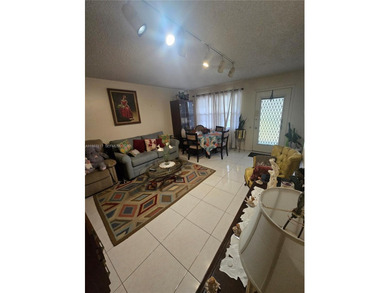This inviting 2-bedroom, 1.5-bathroom condo on the 2nd floor on Flamingo Lakes Country Club in Florida - for sale on GolfHomes.com, golf home, golf lot
