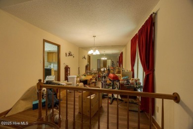Stunning ranch-style home in River Bend! This one-story offers a on River Bend Golf and Country Club in North Carolina - for sale on GolfHomes.com, golf home, golf lot
