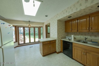 Stunning ranch-style home in River Bend! This one-story offers a on River Bend Golf and Country Club in North Carolina - for sale on GolfHomes.com, golf home, golf lot