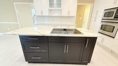 One-of-a-kind Luxurious, Custom-Built Home in Bluewater Bay! on Fairway Oaks at Magnolia Golf Course in Florida - for sale on GolfHomes.com, golf home, golf lot