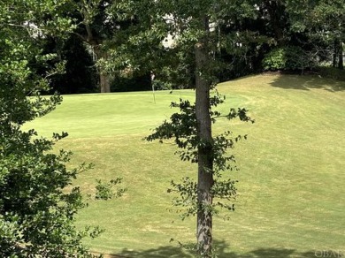 Golf course views over the thirteenth green with a spacious deck on Seascape Golf Links in North Carolina - for sale on GolfHomes.com, golf home, golf lot