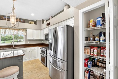 LOCATED ON THE 4TH HOLE IN THE GOLF COURSE COMMUNITY OF on Summerfield Crossing Golf Club in Florida - for sale on GolfHomes.com, golf home, golf lot