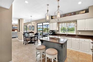 LOCATED ON THE 4TH HOLE IN THE GOLF COURSE COMMUNITY OF on Summerfield Crossing Golf Club in Florida - for sale on GolfHomes.com, golf home, golf lot