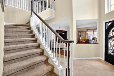 LOCATED ON THE 4TH HOLE IN THE GOLF COURSE COMMUNITY OF on Summerfield Crossing Golf Club in Florida - for sale on GolfHomes.com, golf home, golf lot