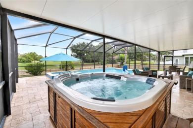 LOCATED ON THE 4TH HOLE IN THE GOLF COURSE COMMUNITY OF on Summerfield Crossing Golf Club in Florida - for sale on GolfHomes.com, golf home, golf lot