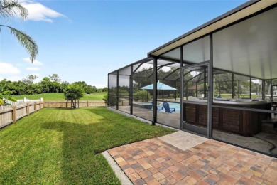 LOCATED ON THE 4TH HOLE IN THE GOLF COURSE COMMUNITY OF on Summerfield Crossing Golf Club in Florida - for sale on GolfHomes.com, golf home, golf lot