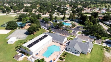 LOCATED ON THE 4TH HOLE IN THE GOLF COURSE COMMUNITY OF on Summerfield Crossing Golf Club in Florida - for sale on GolfHomes.com, golf home, golf lot