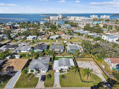 Welcome home to laid-back coastal living in the heart of Dunedin on The Dunedin Country Club in Florida - for sale on GolfHomes.com, golf home, golf lot