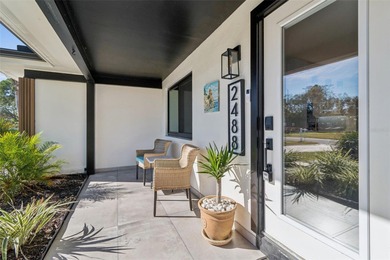 Welcome home to laid-back coastal living in the heart of Dunedin on The Dunedin Country Club in Florida - for sale on GolfHomes.com, golf home, golf lot