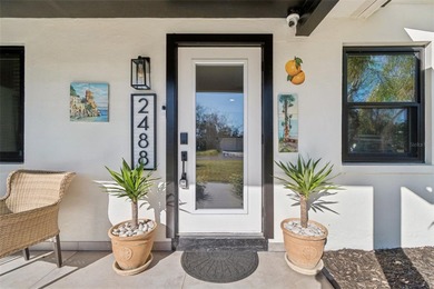 Welcome home to laid-back coastal living in the heart of Dunedin on The Dunedin Country Club in Florida - for sale on GolfHomes.com, golf home, golf lot