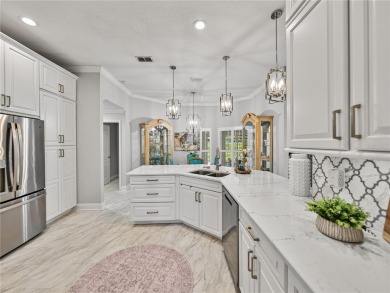 STUNNING CURB APPEAL on this GORGEOUS FULLY REMODELED PANORAMIC on Tampa Bay Golf and Country Club in Florida - for sale on GolfHomes.com, golf home, golf lot