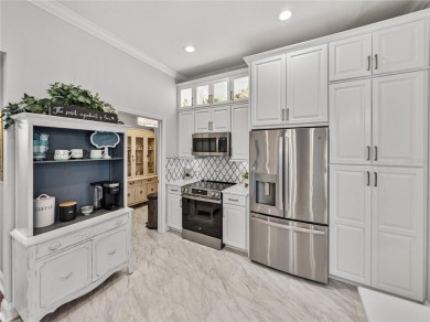 STUNNING CURB APPEAL on this GORGEOUS FULLY REMODELED PANORAMIC on Tampa Bay Golf and Country Club in Florida - for sale on GolfHomes.com, golf home, golf lot
