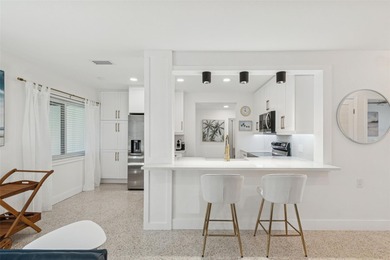 Welcome home to laid-back coastal living in the heart of Dunedin on The Dunedin Country Club in Florida - for sale on GolfHomes.com, golf home, golf lot