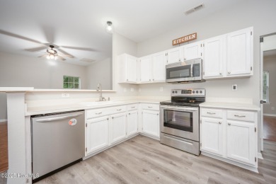 Welcome Home! This beautiful 4-bedroom, 2.5-bath home offers on Eagle Creek Golf Club and Grill in North Carolina - for sale on GolfHomes.com, golf home, golf lot
