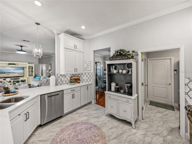 STUNNING CURB APPEAL on this GORGEOUS FULLY REMODELED PANORAMIC on Tampa Bay Golf and Country Club in Florida - for sale on GolfHomes.com, golf home, golf lot